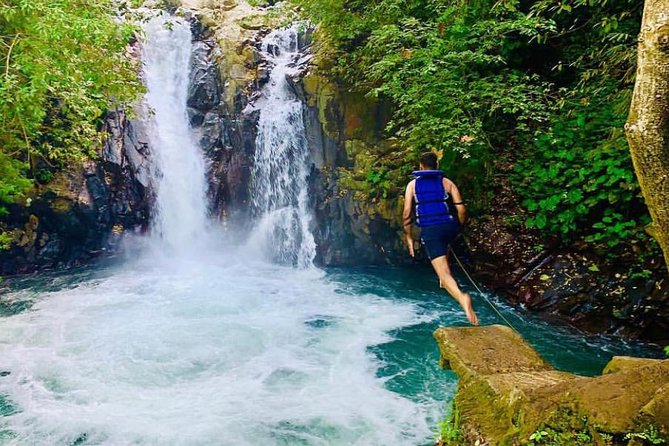 All Inclusive : Jumping Sliding at Aling- Aling Waterfall - Handara Gate - Lunch - Handara Gate gives the day a change of pace