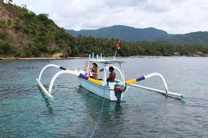Amazing Blue Lagoon Snorkeling with Private Hotel Transfer - Reaching Blue Lagoon by traditional boat