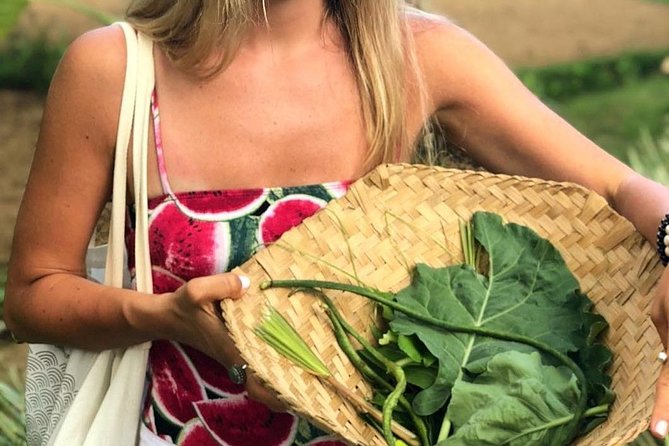 From Ubud: Authentic Bali Farm Cooking School & Organic Farm - Picking ingredients in an organic garden
