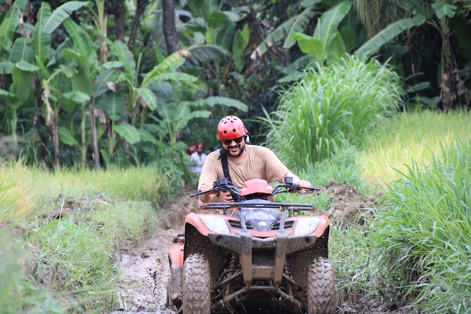 Ubud ATV Quad Bike with Ayung River Rafting Experience - ATV riding through rice fields, tunnels, and waterfalls