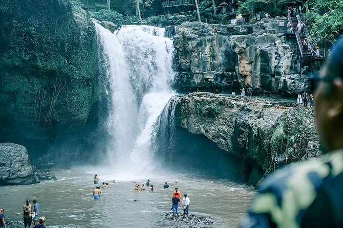 Ubud Tour with Jungle Swing and Waterfall Water Temple - Descending to Tegenungan Waterfall